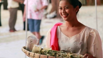 Filipina Carrying a Bilao